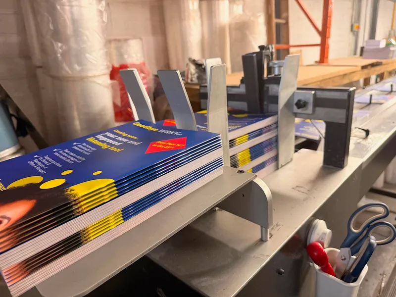 Personalised inserts stacked and ready on the inserting line