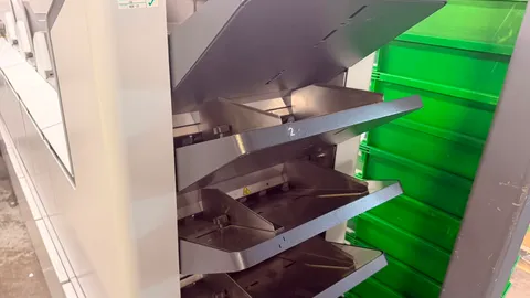 Numbered stacker trays sorting a mailing to qualify for the best An Post rate